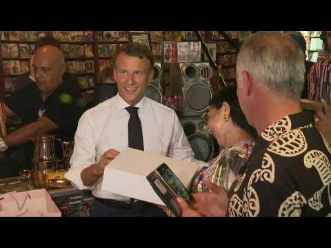 France's President Emmanuel Macron visits disco Maghreb Shopin, mythical rai music label