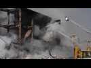 Rescue workers fight fire at Yerevan market explosion site