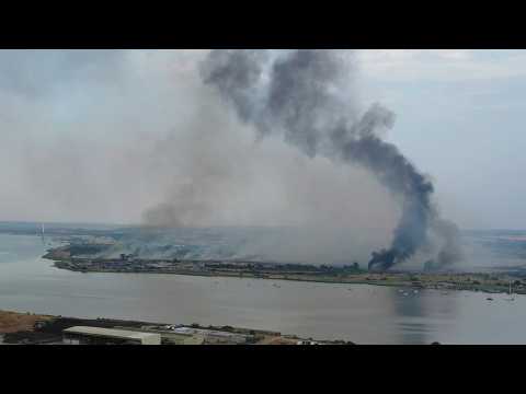 Aerial shots show multiple fires on outskirts of London