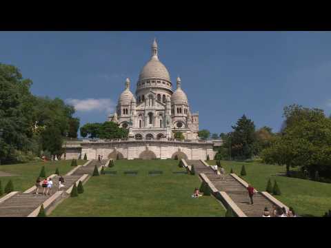 Parisians bask in sunshine at Sacre Coeur basilica