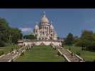 Parisians bask in sunshine at Sacre Coeur basilica
