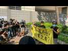 Supporters of Hong Kong's Apple Daily gather outside court