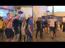 Victorious Chelsea fans celebrate as they leave Porto stadium