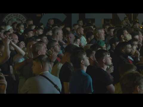 Disappointed Man City fans console each other after losing Champions League final