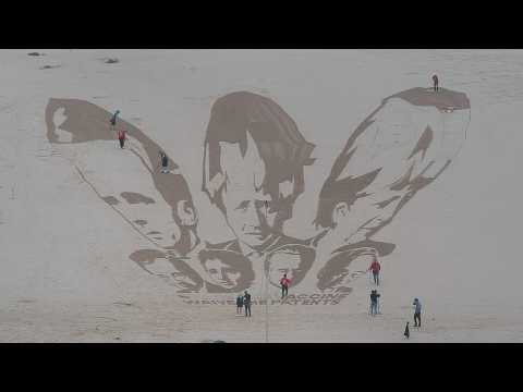 Sand art protest calls for G7 leaders to waive Covid vaccine patents