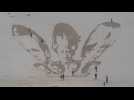 Sand art protest calls for G7 leaders to waive Covid vaccine patents