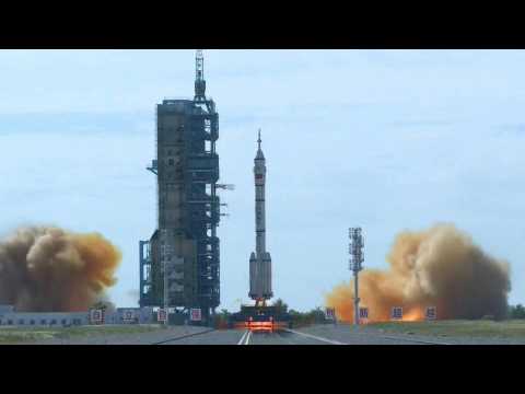 Chinese rocket blasts off carrying crew to new space station