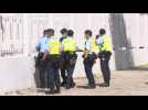 Hong Kong police raid pro-democracy newspaper Apple Daily (2)