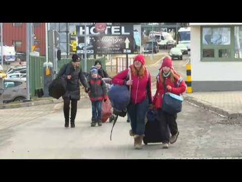 Ukrainians enter neighbouring Poland to escape Russian invasion