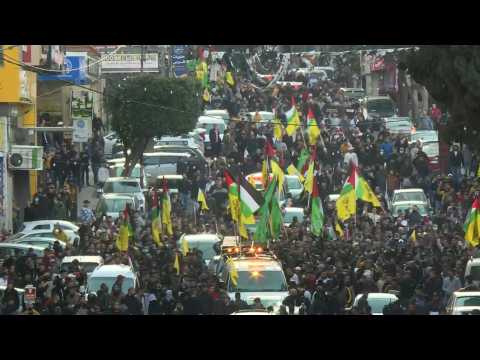 Mourners attend funeral of Palestinians killed in Israeli raid