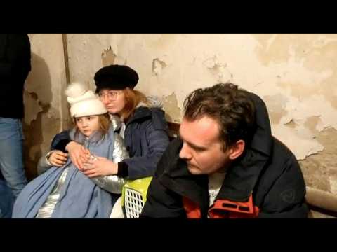 Ukrainians shelter in a basement as fighting begins in Kyiv streets