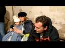 Ukrainians shelter in a basement as fighting begins in Kyiv streets
