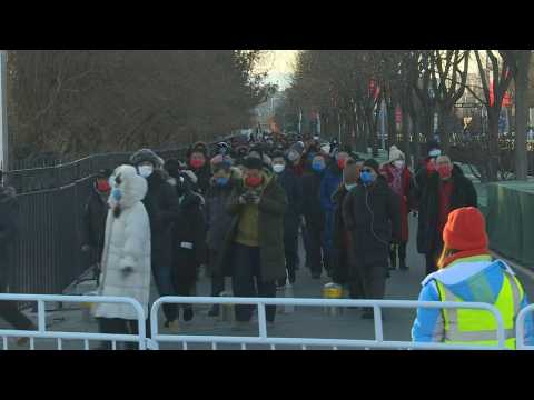 Crowds selected for Beijing Olympics opening ceremony walk toward Bird's Nest