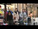 Images of people walking in Rome as outdoor mask mandate lifted