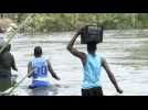 Migrants cross Rio Bravo river between Mexico and the US