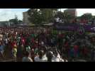 Supporters greet exiled opponents arriving at Conakry airport after fall of Conde