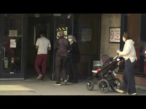 Canada's snap election: People wait in line in Montreal as polls open