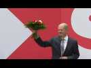 Olaf Scholz receives flowers after Germany's Social Democrats win election