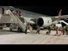 Passengers from Kabul flight disembark in Doha