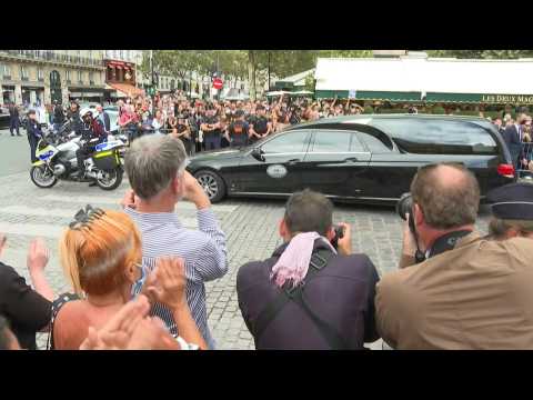 Hearse carrying late French actor Belmondo departs after ceremony
