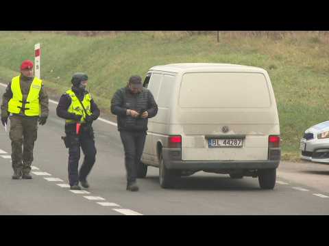 Scene at checkpoint of entrance to emergency zone near Polish-Belarusian border
