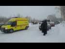 Emergency vehicles arrive, as eleven dead, dozens missing in Siberia coal mine accident