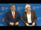 Hungarian PM Orban and French far-right presidential candidate Le Pen arrive at Warsaw conference
