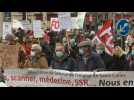 French protesters march to defend public health service