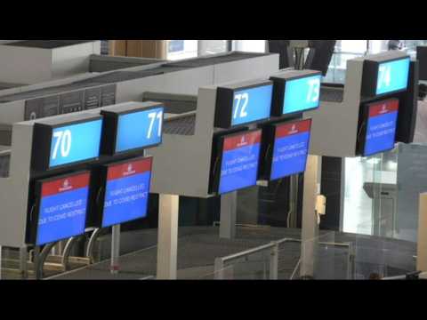 Passengers stranded at Cape Town airport as world races to contain new Covid strain