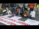 Migrants part of a caravan protest in Mexico City