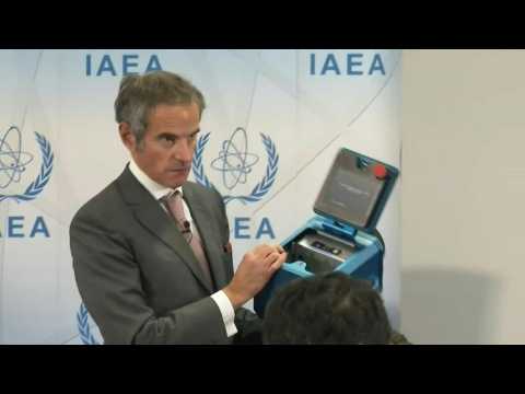 IAEA Director General shows the type of cameras used in Iranian facility