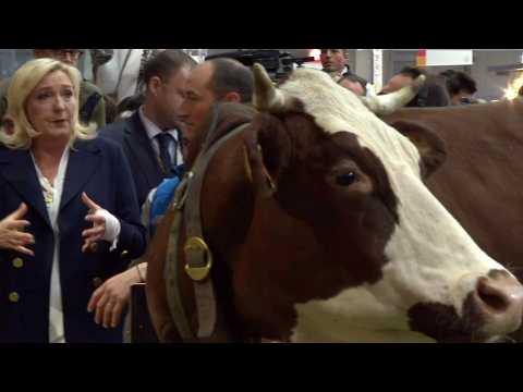 French poll hopeful Le Pen meets farmers at Paris agricultural fair