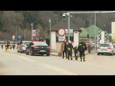 Ukrainian refugees enter Poland after fleeing Russian invasion
