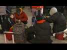 Ukrainian refugees wait at train station on Polish border