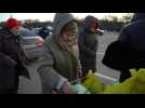 People receive humanitarian aid after fleeing besieged city of Mariupol