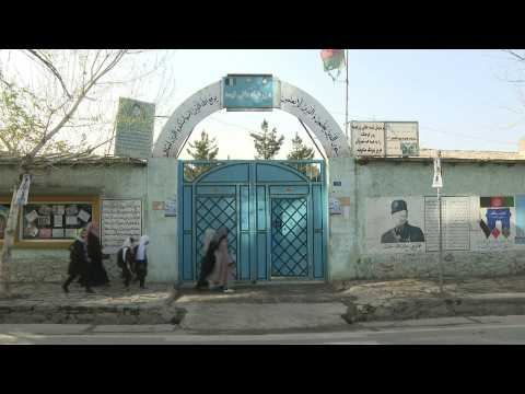 Afghan girls head back to school as Taliban end ban