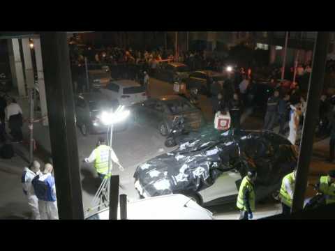 Israelis gather on site of an attack that killed five near Tel Aviv (2)