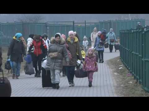 Ukrainian refugees fleeing shelling arrive in Poland