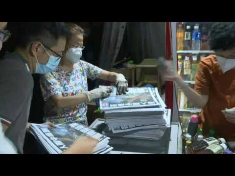 Hong Kongers queue to buy copies of pro-democracy paper's last edition