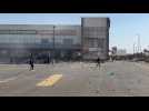 South African police fire rubber bullets to disperse looters