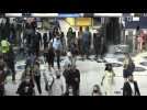 Commuters at London train station as England removes mask mandate