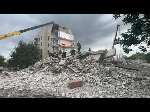 Rescuers search through the rubble after a strike in eastern Ukrainian town of Chasiv Yar