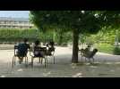 Heatwave: Parisians and tourists seek shade in a park as temperatures peak in the French capital