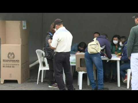Polls open in unpredictable Colombia election runoff