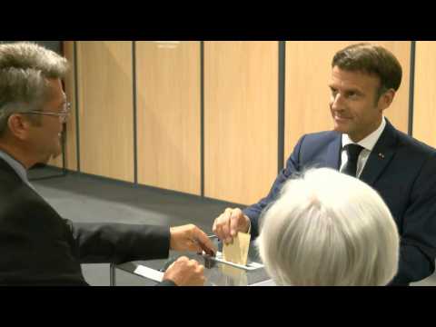 Macron and wife cast votes in crunch parliamentary election