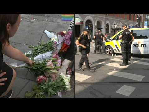 People lay flowers at site of Oslo shooting
