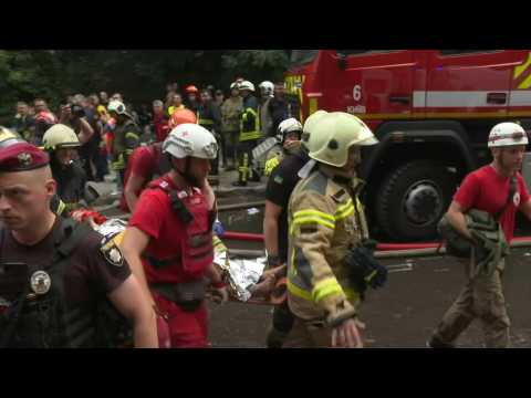 Firefighters rescue woman after Russia strikes Kyiv residential neighbourhood