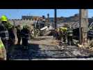 Rescue workers clear rubble after deadly missile attack on mall in Ukraine
