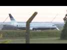 People board plane which is to take UK asylum seekers to Rwanda