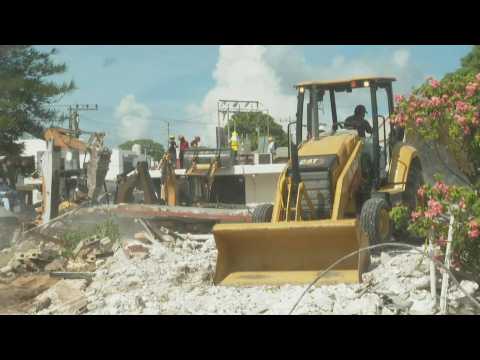 Teams clean-up debris after deadly church roof collapse